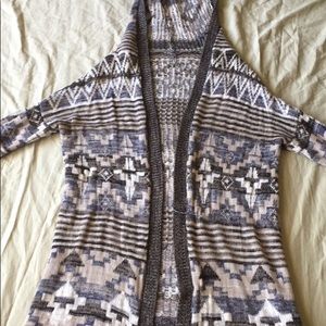 A ladies sweater with hoodie